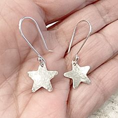 These Silver Star Earrings are a perfect gift for any stargazer, astrology buff or a lovely Christmas accessory. Timeless and ageless these will never go out of style.  The stars are cut from sterling silver sheet and dangle from MetalRocks signature handmade Ear Wires. My ear wires are a little longer than the average at .75 inches.  Should you prefer a smaller ear wire please just let me know.  The stars are a half inch in height and width.  The earrings will come in a lovely black gift box with rubber earrings backs for safety.  I've been studying astrology since the 1970's and have several published columns. Should you wish an astrology chart run please contact.  All my pieces are handmade by me personally especially for you! Celestial Christmas, Rubber Earrings, Silver Star Earrings, Astrology Chart, Christmas Accessories, Black Gift Boxes, Christmas Gift Idea, Black Gift, Silver Stars