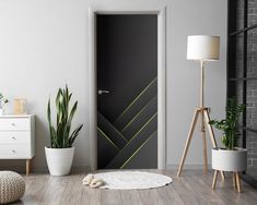 an open door in a modern living room with potted plants on the floor and a lamp next to it