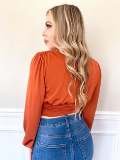 Get a bold look with this eye-catching vibrant rust color Shera Crop Top. Eye-catching top styled with a plunging neckline, and long puff sleeves. You will fall in love with this undeniably stylish and fashionable crop top. Rock the day by pairing this sexy crop top with pants and high heels. Material: 95% Polyester, 5% Spandex Sleeve Length: Full Sleeves Sleeve Style: Puff Neck Style: Plunging neckline Color: Rust Size: Small, Medium, Large Crop Top With Pants, Top With Pants, High Heel Boots Knee, She Ra, Long Puff Sleeves, Jogger Set, Full Sleeves, Rust Color, Plunging Neckline