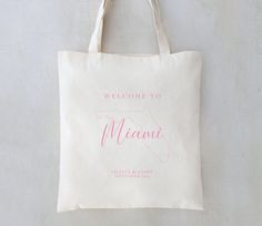 a tote bag that says welcome to the state of michigan with pink ink on it