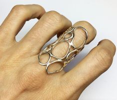 This is a sterling silver organic statement ring.This is an elegant ring which can be worn as an everyday ring.It has a shiny finish but it can be matt If you want.It is also available in rough finish in silver and gold plated silver: https://www.etsy.com/listing/258207731/gold-statement-ring-silver-organic-ring MATERIALS: sterling silver 925 DIMENSION:approximately the biggest dimension is 4 cm (1 5/8 in.) I can make this ring to your size.You can find your size by looking here: http://www.blue Sterling Silver Statement Ring, Big Silver Rings, Organic Shape Jewelry, Big Rings For Women, Architectural Rings, Statement Rings Unique, Funky Rings, Big Ring, Silver Statement Earrings