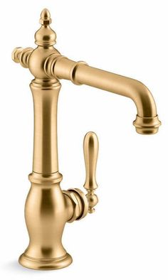 an antique brass faucet with two handles