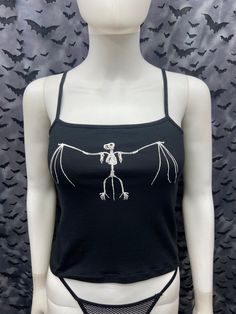 This is a black sleeveless Bat skeleton cropped tank top. This has a Bat image screen printed on the front in white ink. 57% cotton/ 38% polyester/ 5% Spandex These are handmade screenprinted and slightly vary from the photo. Please feel free to email me any questions. Thanks for looking. The seller is not responsible for any lost or stolen packages. Skeleton Crop Top, Bat Top, 23 Outfit, Bat Skeleton, Band Tank Tops, Crop Top Sleeveless, Boho Goth, Hoodie Diy, Style Chart