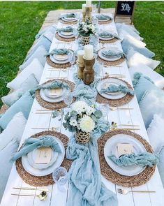 a long table set with plates and place settings