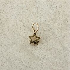 Versatile 14K Gold Star Charm Discover the charm of our versatile 14K Gold Star Charm, designed to elevate your jewelry collection with a playful yet elegant touch. This meticulously crafted piece showcases a delightful double star design, making it a true standout. Whether you wear it solo or mix it with other charms, it effortlessly enhances the beauty of your necklaces and bracelets, adding a sprinkle of sophistication to any outfit. Features of our 14K Gold Charm 14K gold star Closed jump ri Estate Jewelry Rings, Jewelry Gift Guide, Candy Necklaces, Gold Charm Necklace, 14k Gold Necklace, Star Design, Charm Rings, Gold Star, Fine Jewellery Earrings