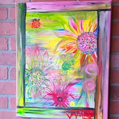 a painting on a brick wall with flowers and ladybugs in the window sill