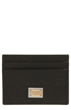 Carry your cards and currency in the contemporary-luxe style of this Italian-calfskin card holder detailed with a gleaming brand-engraved placard. Four card slots; slip pocket Leather Made in Italy Designer Handbags Elegant Leather Card Holder, Elegant Leather Card Holder With Rfid Blocking, Designer Wallets With Card Slots For Formal Occasions, Luxury Leather Card Holder With Card Slots, Luxury Leather Card Holder With Slots, Formal Rectangular Card Holder With Engraved Logo, Rectangular Card Holder With Engraved Logo, Modern Rectangular Card Holder With Logo Plaque, Designer Leather Card Holder With Card Slots