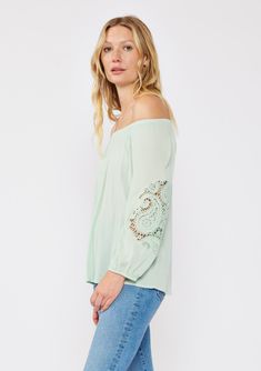 A casual bohemian blouse with a beautiful paisley lace detail on sleeve. Relaxed, flowy fit Elastic on or off-shoulder neckline 3/4 length sleeves Elastic wrist cuff Lace detail Flowy bohemian blouse Dry clean recommended or hand wash cold Step into effortless bohemian chic with this versatile blouse, beautifully designed with intricate paisley lace detailing. The relaxed fit effortlessly flatters any figure, while the elastic round neckline offers different styling options. Wear it as-is for a Casual Off-shoulder Long Sleeve Top For Summer, Chic Summer Off-shoulder Long Sleeve Top, Chic Off-shoulder Long Sleeve Top For Summer, Chic Off-shoulder Long Sleeve Top For Spring, Feminine Long Sleeve Off-shoulder Top For Spring, Bohemian Spring Tops With 3/4 Sleeves, Bohemian Tops With Lace Sleeves For Fall, Feminine Long Sleeve Off-shoulder Top, Casual Off-shoulder Peasant Top