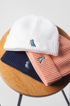 Embroidered little dino design on our soft, thick knit beanies. Premium embroidery threads with 8 unique pastel colours of hats available to choose from. Whether buying for yourself or as a gift, it is an excellent choice that is sure to make a statement. Makes a great gift for friend, family or even yourself. The must have wardrobe classic! All of our items are made in Britain in our London studio & are made to order, only when you place an order. Never mass produced. ✅ DETAILS ✅ Product Type: White Knit Casual Beanie, Casual White Knit Beanie, White Cotton Hats For Cold Weather, White Casual Crochet Hat For Cold Weather, Casual White Crochet Hat For Cold Weather, White Warm Casual Bonnet, Casual Warm White Bonnet, Casual White Knitted Bonnet, Knitted Cotton Hats For Cold Weather