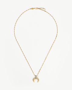 Lucy Williams Pavé Horn Pendant Necklace | 18ct Gold Plated Vermeil/Cubic Zirconia. A Classic, Reimagined. Inspired by Our Original Lucy Williams X Missoma Trendsetting Design, the Large Horn Pendant Features Cubic Zirconia Snow Pavé for a Fine-Style Jewelry Finish, Paired with a Mini Figaro Chain. Style with a Classic Choker for a Layered Look. Metal: 18Ct Recycled Gold Plated Vermeil on Recycled Sterling Silver Pendant Dimensions: 16. 6mm X 17mm Length: 500mm Gemstone: Cubic Zirconia Weight: 7 Luxury Gold-plated Necklaces With Pave Setting, Luxury Gold-plated Necklace With Pave Setting, Gold Plated Necklaces With Pave Setting For Gift, Yellow Gold Plated Necklaces With Pave Setting, Gold Plated Pave Setting Necklace For Gift, Yellow Gold Plated Necklace With Pave Setting, Yellow Gold-plated Necklace With Pave Setting, Refined Gold Jewelry With Pave Setting, Luxury Everyday Gold Jewelry With Pave Setting