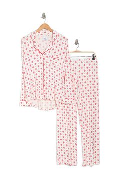 A soft jersey knit pajama set with a pretty print delivers feminine style and essential comfort. 2-piece set Shirt: 25" length (size S); Pants: 9.5" rise, 32" inseam (size S) Shirt: notch lapel, long sleeves, front button closures, chest patch pocket, allover print, contrast piping, knit construction Pants: elasticized waist, pull-on style, allover print, knit construction 95% rayon, 5% spandex Machine wash cold Imported Model’s stats for sizing: 5’11” height, 32” bust, 24” waist, 34” hips. Mode Printed Relaxed Fit Sleep Sets, Printed Sets With Relaxed Fit For Sleep, Printed Sets With Relaxed Fit For Lounging, White Printed Loungewear Sets, White Relaxed Fit Sets For Pajama Party, White Matching Set Sleepwear For Lounging, Long Sleeve Printed Loungewear Sets, Long Sleeve Printed Lounging Sets, Printed Long Sleeve Lounging Sets