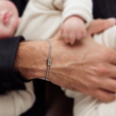 "Introducing our exquisite custom silver bracelet, designed with love for the most important man in your life, Dad. This bracelet is adorned with the names of your precious kids, making it a cherished keepsake he will proudly wear and show off to everyone he meets. Handcrafted with utmost attention to detail, each bracelet is made from high-quality stainless steel, ensuring durability and longevity. The personalized touch adds a heartfelt and sentimental element, making this piece a truly unique and meaningful gift for any occasion. Whether it's Father's Day or his birthday, this custom bracelet is the perfect way to honor the bond between a father and his little ones. Order now and give Dad a gift he will treasure forever. Material: Stainless steel. Bracelet length: 7\" (18 cm) + 1.18\" ( Minimalist Silver Bracelets For Father's Day, Minimalist Name Bracelet For Father's Day Gift, Silver Chain Bracelet For Father's Day, Silver Bracelets For Father's Day Gift, Jubilee Bracelet For Father's Day Gift, Engraved Sterling Silver Beaded Bracelet As Gift, Engraved Sterling Silver Beaded Bracelets As Gift, Father's Day Gift Jubilee Bracelet, Father's Day Engraved Silver Bracelets