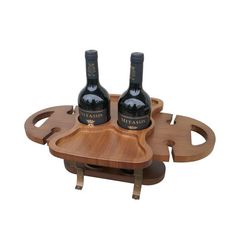 two bottles of wine sitting on top of a wooden tray