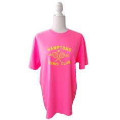 Serve up some serious style with the Hamptons Tennis Club T-Shirt! This preppy tee is the perfect way to add a pop of color to your to your summer wardrobe. Comfortable and stylish, it's perfect for the beach, pool or simply enjoying a warm day. But it's not just about style - this neon pink t-shirt, made by comfort colors is made with comfort in mind. Get ready to be the trendsetter this summer (and don't forget to size up for a trendy oversized fit!) Fabric: 100% Cotton Design: Neon Yellow hea Summer Sports T-shirt With Screen Print, Short Sleeve Summer Tennis Tops, Summer Short Sleeve Tennis Tops, Spring Tennis Tops With Graphic Print, Preppy Short Sleeve Summer T-shirt, Summer Tennis Tops With Short Sleeves, Short Sleeve Tennis Tops For Summer, Spring Sports T-shirt Pre-shrunk, Preppy Short Sleeve T-shirt For Summer