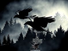 two black birds flying over a cross in front of a forest with trees and clouds