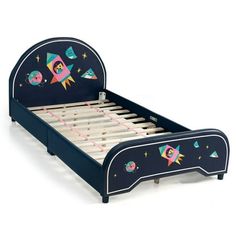 a child's bed with an outer space theme on the headboard and foot board