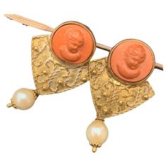 Stunning Antique Victorian era solid 18kt yellow gold earrings for pierced ears featuring carved lava cameo tops . Earrings have Etruscan style applied wire and bead work on front side with cultured pearl dangle . marked 18kt ITALY with faded stamp and Star 319 NA on backside of both earrings Tops Earrings, Cameo Earrings, Yellow Gold Earrings, Yellow Gold Earring, Pierced Ears, Antique Victorian, Victorian Era, Ear Piercings, Bead Work