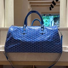 Goyard Bag Luxury Top Handle Travel Bag For Errands, Luxury Travel Bag With Top Handle For Errands, Designer Blue Satchel With Large Capacity, Luxury Satchel Travel Bag For Errands, Designer Blue Bag With Double Handle, Luxury Rectangular Duffle Bag For Errands, Luxury Double Handle Duffle Bag For Shopping, Luxury Blue Top Handle Bag, Luxury Tote Duffle Bag For Shopping