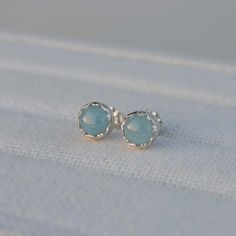 These sterling silver stud earrings feature 6mm round Aquamarine stones set in a fancy bezel.  ★ All orders come wrapped in a gift box, ready for gifting ★ Round Earrings With Bezel Setting, Sterling Silver Earrings With Bezel Setting As Gift, Blue Bezel Set Earrings For Gift, White Gold Earrings With Round Stone For Gift, Silver Bezel Set Earrings As Gift, Silver Bezel Setting Earrings For Gift, White Gold Earrings With Bezel Setting For Gift, Stud Earrings Silver, Aquamarine Earrings