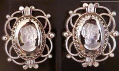 These were my great grandmas. I inherited them in the 80s. It's hard to get a good picture that will depict the show the detail that they have but they are more beautiful in person. Victorian Cameo Earrings For Formal Occasions, Antique Silver Clip-on Earrings For Wedding, Vintage Silver Plug Earrings For Wedding, Silver Hallmarked Clip-on Earrings For Formal Occasions, Ornate Silver Clip-on Earrings For Formal Occasions, Antique Clip-on Earrings For Vintage Events, Victorian Silver Clip-on Earrings For Wedding, Antique Clip-on Earrings For Anniversary, Silver Victorian Clip-on Earrings For Wedding