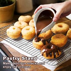 a person pouring chocolate onto donuts on a cooling rack with the words pastry stand make delicious snacks and enjoy the process