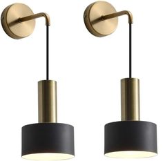 two lights that are next to each other on a white background, one is gold and the other is black