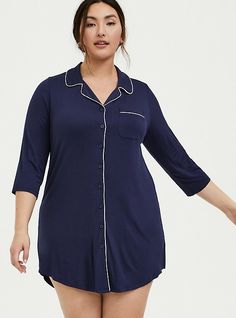 Cozy up in an undeniably soft sleep shirt that comes in a tunic length with contrast white piping that pops. Notch collar. V-neck. Chest pocket. 3/4 sleeves. Button front. Contrast white piping. CONTENT + CARERayon/spandex. Wash cold; dry flat. Imported plus size sleepwear. SIZE + FITModel is 5’11”, size 1. Size 2 measures 38” from shoulder. The best plus size women's super soft button through sleep gown tops & dresses in navy. These comfy pajamas will be your favorite PJs to sleep in or lounge Pregnancy Gown, Sleep Gown, Chemise Dress, Plus Size Sleepwear, Pajamas Comfy, Button Up Dress, Notch Collar, Sleepwear & Loungewear, Sleep Shirt