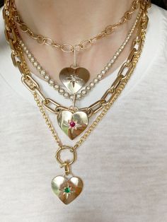 A vintage vibe emanates from this pairing of our Galaxy Heart Pendant and Oval Link Charm Chain. The pendant is hand engraved with a star and accented with your choice of a burnished set Diamond, Ruby, Pink Tourmaline, Blue Sapphire, Turquoise or Emerald. 3.5grams 14kt Gold, Polished Finish .20cts Precious or Semi-Precious Gemstone .5" Elongated Pave Diamond Enhancer (Included) 16" Chain, 1" Pendant Exquisitely Handcrafted in Los Angeles Galaxy Heart, Diamond Enhancer, Our Galaxy, Crystal Heart Necklace, Vintage Ideas, Heart Pendants, Jewelry Tattoo, Romantic Jewellery, Charm Chain