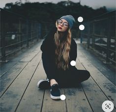 a woman sitting on a wooden bridge with bubbles above her head and the caption below