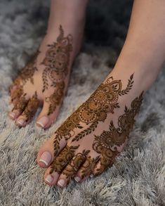 the feet are decorated with henna