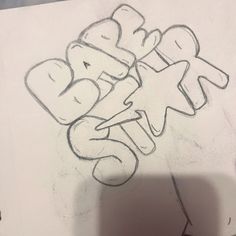 someone is drawing graffiti on a piece of paper