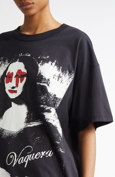 Vaquera utilizes their signature playfulness to reinterpret a masterpiece on this still-recognizable graphic T-shirt. Wholly owned by Comme des Garçons, this brand is part of Dover Street Market Paris, created with the goal of bringing emerging brands to market. 30" length (size Medium) Crewneck Short sleeves 100% cotton Dry clean Made in Turkey Designer Clothing Oversized Artistic Graphic Print T-shirt, Artistic Oversized Graphic Print T-shirt, Artistic Oversized T-shirt With Graphic Print, Oversized Artistic Crew Neck T-shirt, Artistic Oversized Graphic Tops, Black Top With Graphic Print For Artistic Expression, Black Graphic Print Tops For Artistic Expression, Graphic Tee With Letter Print For Artistic Expression, Artistic Crew Neck Top