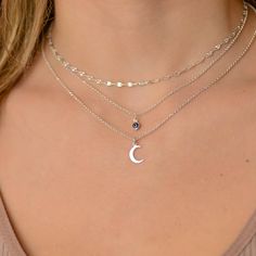 This layered moon and evil eye necklace is a set of 3. The chains are solid sterling silver 925. They have an extension so that the size can be adjusted. The one necklace has a tiny evil eye. The second necklace has small silver crescent moon pendant. The third necklace is a plain chain. If you would like a custom order or have any questions please contact me, thanks. Silver Sterling Silver Charm Necklaces For Layering, Sterling Silver Moon Shaped Delicate Chain Jewelry, Sterling Silver Moon Shaped Delicate Jewelry, Sterling Silver Moon-shaped Jewelry With Delicate Chain, Silver Moon Charm Choker Necklace, Silver Choker Necklace With Moon Charm, Silver Layered Necklace With Moon Charm As A Gift, Silver Layered Moon Charm Necklace For Gift, Silver Layered Necklace With Moon Charm For Gift