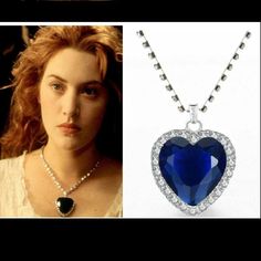 a necklace with a heart shaped blue stone in the center and an image of a woman's face