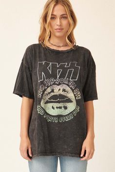 Mineral washed graphic t-shirt. Vintage-style KISS logo print with lips graphic and text that reads, "Rock and Roll All Nite and Party Every Day." Torn and distressed detailing at neckline, cuffs, and hem. Round neckline. Short sleeves. Drop shoulder. Loose, oversized fit. 100% Cotton. Imported top designed and printed in LA. Officially licensed KISS merchandise. Not eligible for discounts. Model wears size S. Trendy Acid Wash T-shirt For Concert, Concert Distressed Washed Black T-shirt, Distressed Washed Black T-shirt For Concert, Edgy Acid Wash Distressed T-shirt, Trendy Washed Tops For Concerts, Distressed Acid Wash T-shirt For Alternative Fashion, Edgy Washed Tops For Concert, Acid Wash Grunge T-shirt For Alternative Fashion, Edgy Stonewashed T-shirt In Washed Black