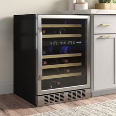 a wine cooler in the corner of a kitchen