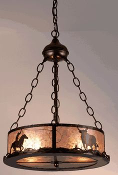 a chandelier hanging from the ceiling with an image of horses on it and text that reads, click to zoom