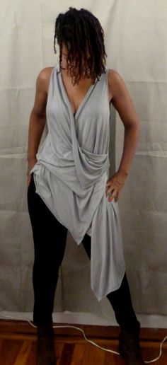 Gray drape top is one of my new tops. You can wear a sports bra under,bikini top,tank top. If you would like the arm hole smaller, please let me know. I love draping tops, because they are stylish for any age,funky,chic and fun to wear. You can wear leggings,skinny jeans or over any plain dress or skirt. The fabric in the picture is rayon Lycra (light weight). I can also make it in ity jersey which is wrinkle free and easy to care for. Every piece of clothing in my shop is made and designed by m Chic Sleeveless Top With Built-in Bra, Drapey Asymmetrical Summer Tops, Chic Tops With Built-in Bra For Layering, Gray Stretch Tops For Summer, Stretch Draped Tops, Versatile Draped Summer Top, Versatile Wrap Top For Night Out, Chic Wrap Tops For Loungewear, Chic Stretch Wrap Top