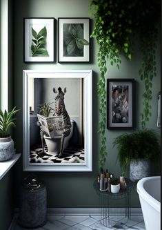 a bathroom with green walls and pictures hanging on the wall, including a zebra in a bathtub