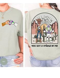 Embark on a nostalgic journey with our "Toy Story Harmony: You've Got a Friend Tee." This cotton t-shirt, inspired by the iconic Toy Story duo Buzz and Woody, brings the magic of friendship to life. On the back, a heartwarming scene unfolds as Buzz and Woody extend their hands, symbolizing the timeless bond of camarade Daisy Crafts, Buzz And Woody, Oopsie Daisy, Dance Marathon, Woody And Buzz, Toy Story Shirt, Friends Tee, Disneyland Shirts, Aunt Shirts