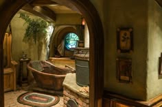 a bath tub sitting in the middle of a bathroom