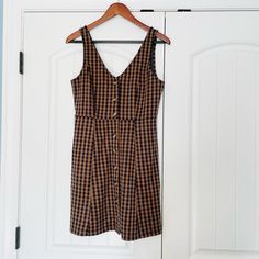 New, Never Worn Size Small Brown V-neck Mini Dress With Buttons, Casual Brown A-line Mini Dress, Brown A-line Sundress, Brown Mini Dress With Buttons For Spring, Brown Knee-length Mini Dress With Buttons, Brown A-line Dress With Buttons, Brown Buttoned Mini Dress For Day Out, Brown Mini Dress With Buttons For Day Out, Brown A-line Mini Dress For Day Out