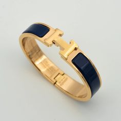 H BLUE BRACELET Timeless Blue Bracelet For Formal Occasions, Designer Blue Bracelet Jewelry, Luxury Blue Bangle Jewelry, Elegant Blue Adjustable Gold Bracelet, Elegant Adjustable Blue Gold Bracelet, Blue Luxury Bangle For Formal Occasions, Elegant Blue Cuff Bracelet With Polished Finish, Luxury Jewelry With Gold Clasp, Formal Blue Bracelet With Polished Finish