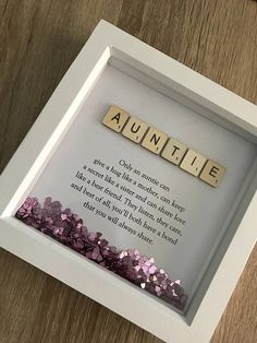 the scrabble name quote box is displayed in a white frame with pink and purple sequins