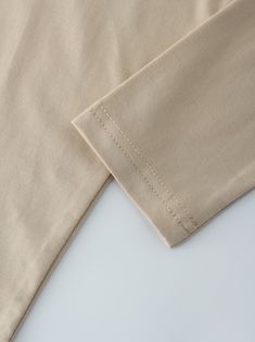 Introducing our Modal Dolman-Sand top! Made with modal fabric, this top is not only stylish, but also incredibly soft and comfortable to wear. Fitted Beige Plain Top, Beige Stretch Top, Beige Stretch Top With Solid Color, Cream Stretch Tops For Loungewear, Beige Stretch Crew Neck Blouse, Solid Viscose Tops For Loungewear, Beige Cotton Blouse For Loungewear, Solid Cotton Blouse For Layering, Stretch Khaki Tops For Loungewear