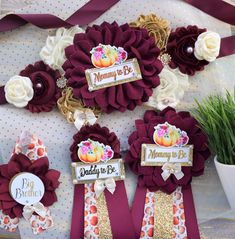 some flowers and ribbons are on display for mom's day or mother's day