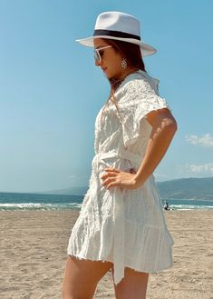 Meerschaum Mini Dress Out in our daring mini white cotton dress! 🤍Make a statement with two layers of white fabric and three-quarter sleeves for any occasion. Be it a wedding, the beach, or any casual or formal outfit- our white dress is perfect for all! Plus, an adjustable belt to customize your look. The Meerschaum Mini Dress is a versatile choice for those who appreciate fashion-forward design and comfort. Its flattering fit and intricate detailing will leave a lasting impression, making you Off-white Long Sleeve Mini Dress For Beach, Beach Mini Dress With Ruffle Sleeves And Details, Flowy Off-white Mini Dress With Lace Trim, White Bohemian A-line Mini Dress, Bohemian Off-white Beach Mini Dress, Mini Dress Blue, White Cotton Dress, Dress Out, Adjustable Belt