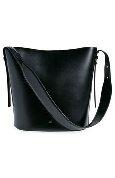 A clean-lined minimalist design defines this spacious bucket bag crafted of smooth calfskin leather. The adjustable strap is wider in the middle for a comfortable carry, either in hand or over the shoulder. Magnetic snap closure Adjustable shoulder strap Structured silhouette with flat base for stability Leather Made in Italy Designer Handbags Black Owned/Founded Modern Structured Bucket Bag With Detachable Handle, Minimalist Bucket Shoulder Bag With Leather Handles, Minimalist Bucket Hobo Bag With Adjustable Strap, Smooth Grain Top Handle Bucket Bag For Work, Everyday Use Structured Leather Bucket Bag, Structured Leather Bucket Bag For Everyday, Modern Structured Bucket Bag For Daily Use, Modern Structured Bucket Bag For Shopping, Modern Structured Bucket Bag For Formal Occasions