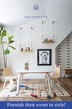 a white table and chairs in a small room with toys on the floor next to it