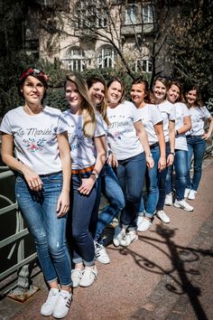 a group of young women standing next to each other